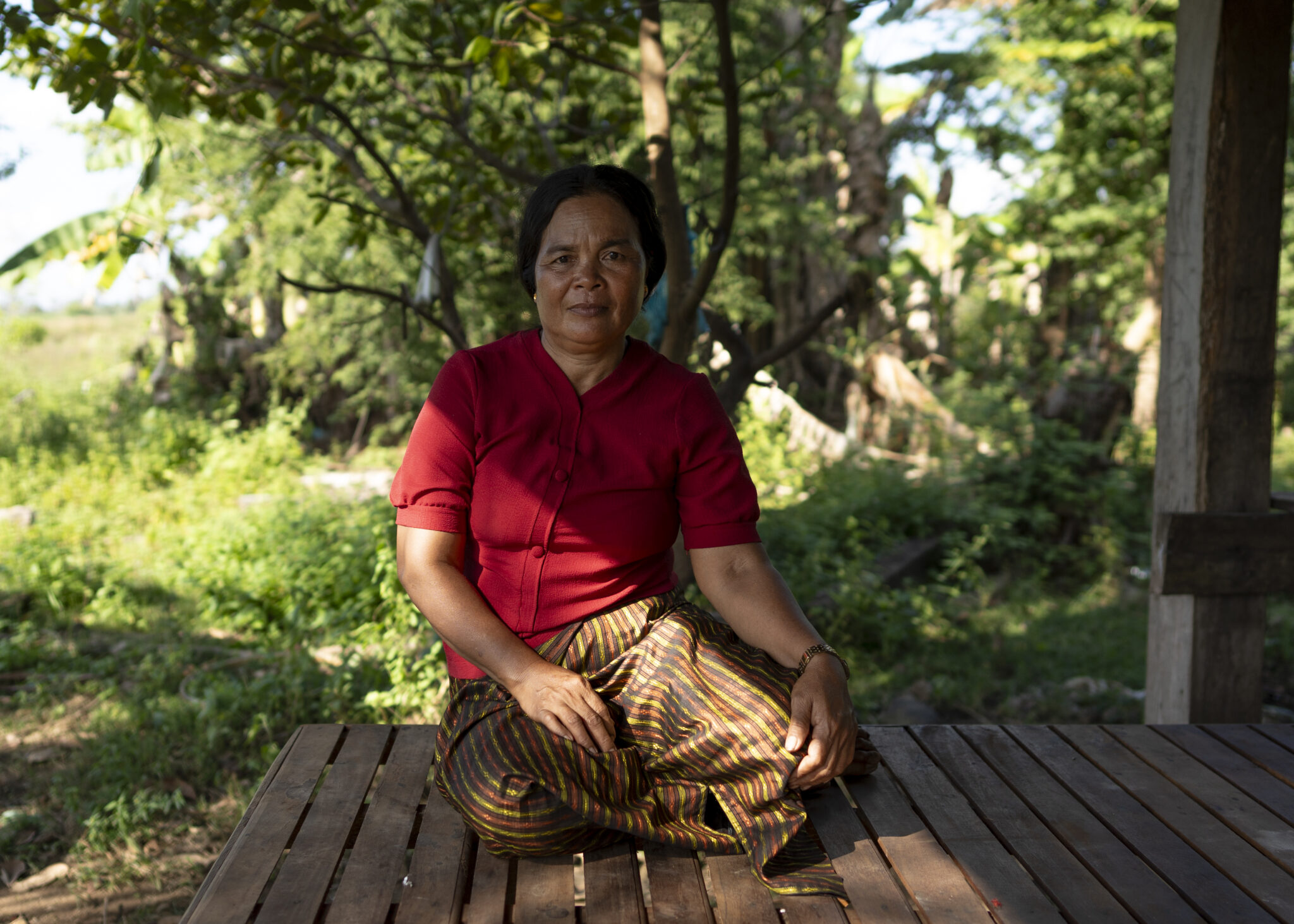 10th December 2023, Mlu Prey Village, Preah Vihear Province, Cambodia. Portrait of Choun Khim, 53 years old, member of Prey Preah Rokar Forest Community Network (PFCN), lives in Mlu Prey Village, Preah Vihear Province. Chuon Khim owns a resin plantation of 300 trees in the forest and works to protect the forest through forest patrolling. She is also a core member of the Peace Bridges Organization, advocating for the community’s rights and ownership of their land and forest. ©Antoine Raab
